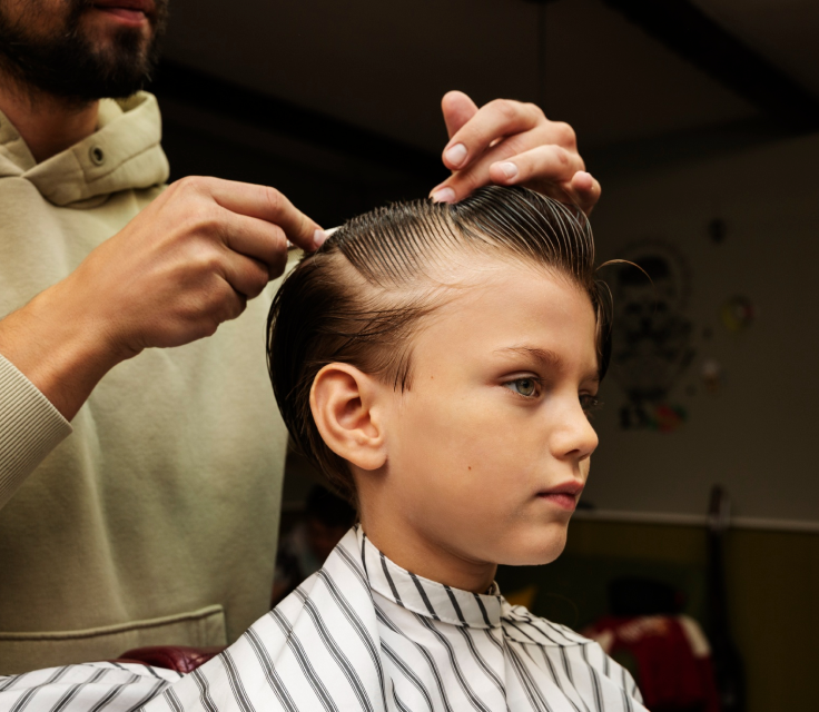 Young boy getting a haircut